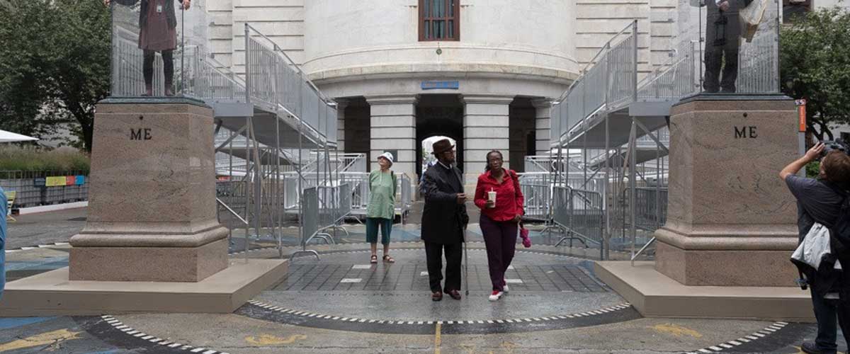 People walking outside of a public monument in philadelphia